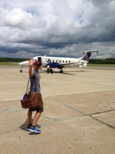 John boarding plane for Colorado VegFest with his favorite Matt & Nat bag