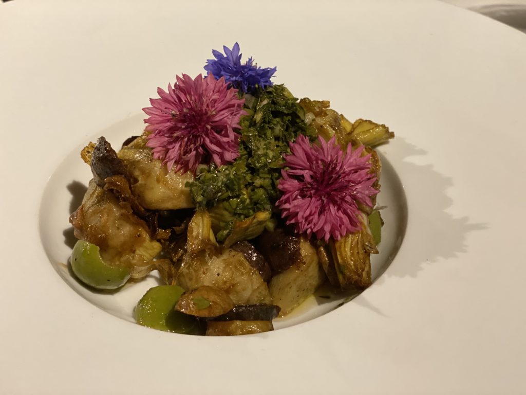 Edible flowers crown an appetizer at the Grand Geneva.