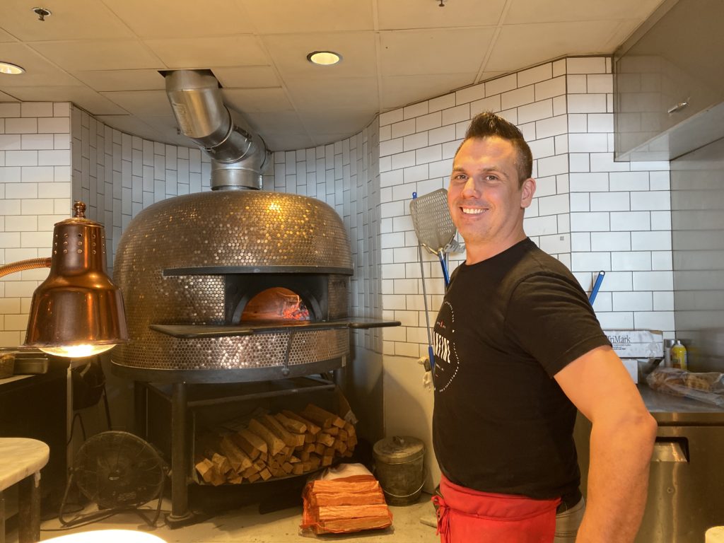 David Scotney, owner of Oakfire in Lake Geneva, with his pizza oven.